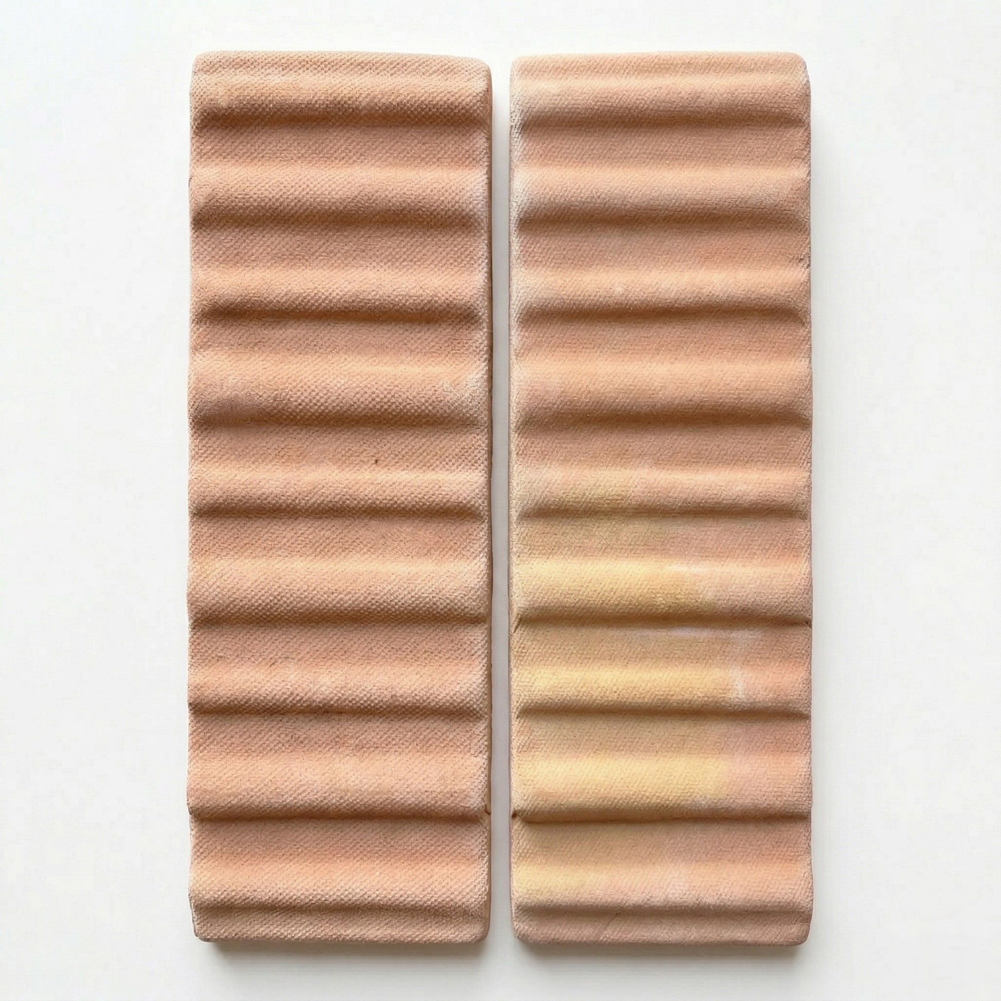 Matte terracotta 3D hatch tiles bundle by Clay Imports, showing two ribbed rectangular pieces with subtle color variation and a woven pattern.