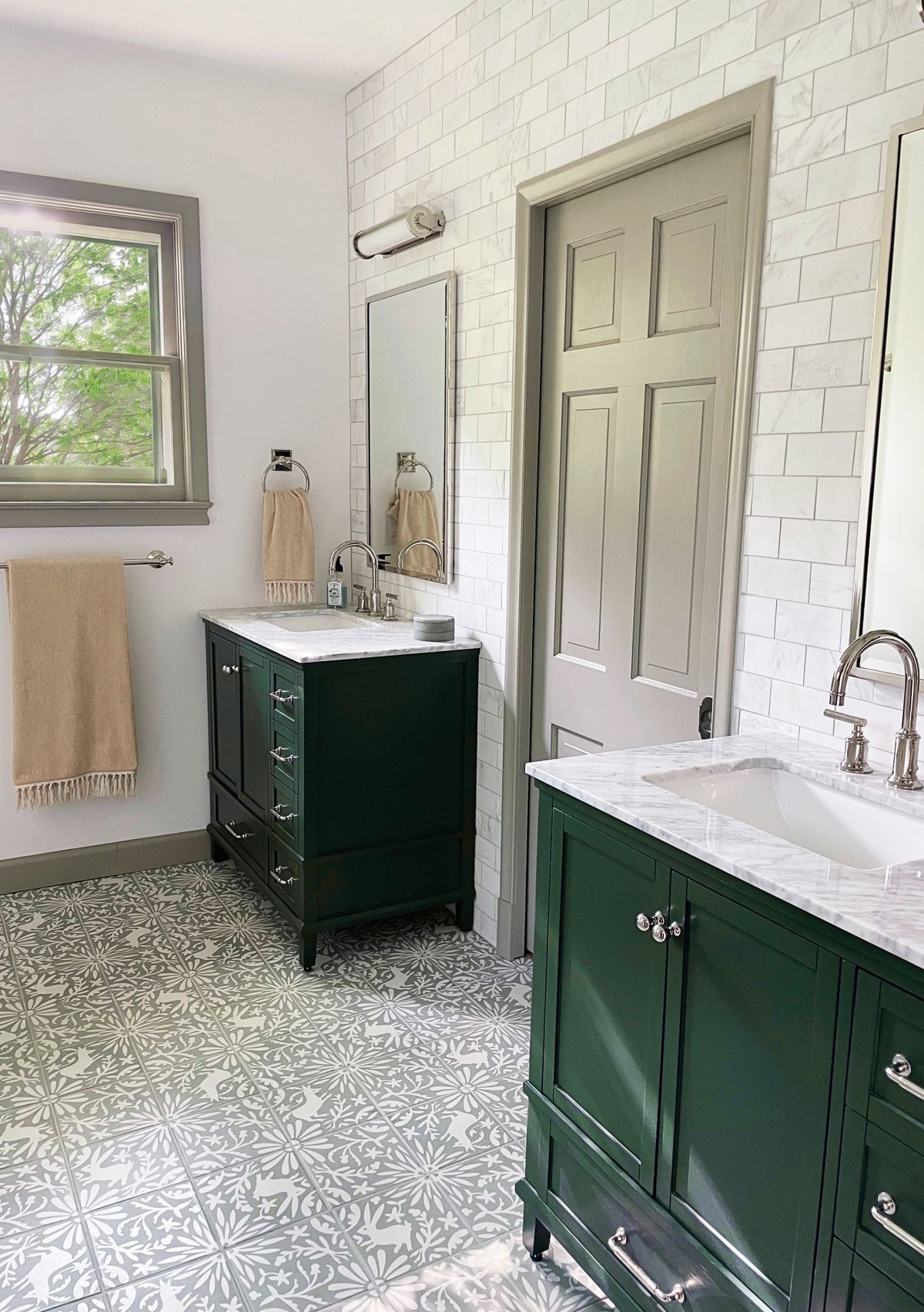 Grey and white Jardín de Luna Herbs Agave 8x8 Pattern Tile by Clay Imports, featuring an intricate floral and deer motif on a bathroom floor.