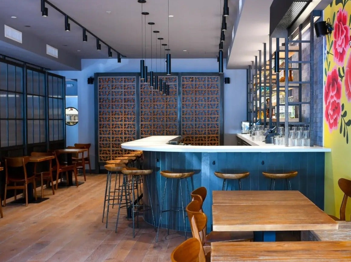 Terracotta Disco pattern Breeze Block by Clay Imports Breeze Blocks, used as decorative wall panels in a modern bar.