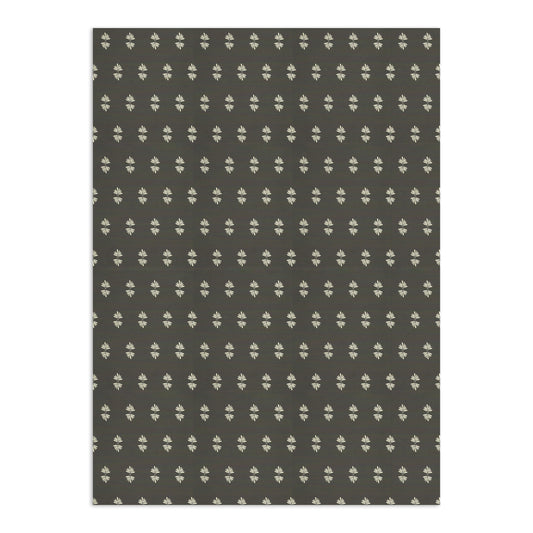 Dark gray wallpaper by Clay Imports with a repeating pattern of small off-white floral motifs.