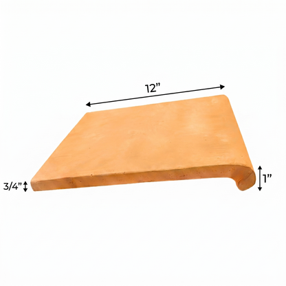 Organic terracotta coping by Clay Imports, 12 inches long, 3/4 inch thick, with a 1-inch bullnose drop.