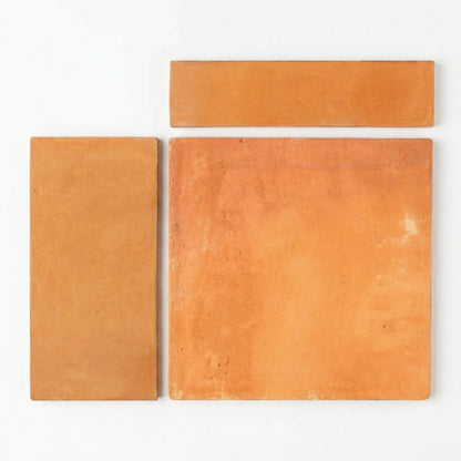 Organic terracotta samples by Clay Imports, three orange-brown pieces with rough texture in varying shapes on white.