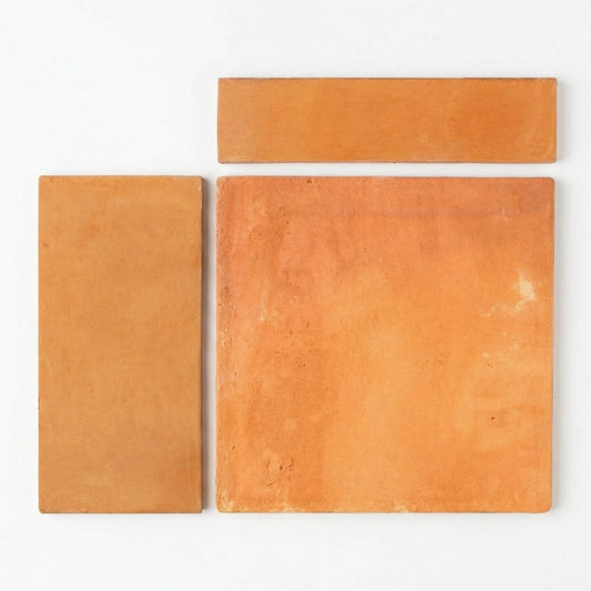Organic terracotta samples by Clay Imports, three orange-brown pieces with rough texture in varying shapes on white.
