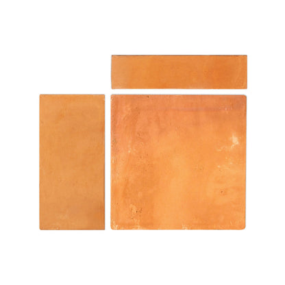 Organic terracotta samples by Clay Imports, three orange-brown pieces with a matte, textured finish arranged geometrically.