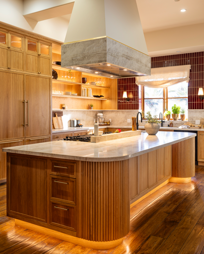 Oxblood 2x8 clay tiles by Clay Imports, with a glossy, reddish-brown vertical subway pattern backsplash in a kitchen.