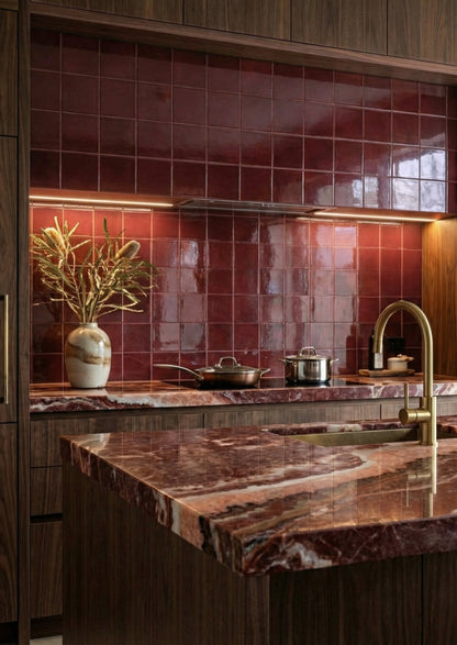 Oxblood 6x6 clay tiles by Clay Imports, glossy finish, installed as a kitchen backsplash above a marbled countertop.