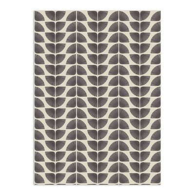 Cream wallpaper with repeating dark gray geometric fan patterns by Clay Imports, featuring a distressed print.