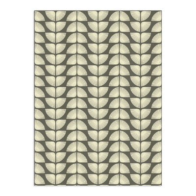 Light beige Petalita Wallpaper by Clay Imports with a distressed geometric fan pattern on a dark gray background.