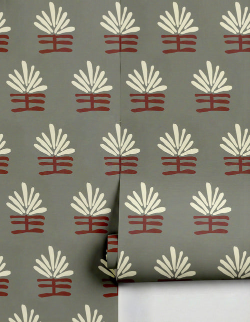 Grey Rama Wallpaper by Clay Imports, featuring a repeating abstract pattern of cream fan shapes above a reddish-brown base.