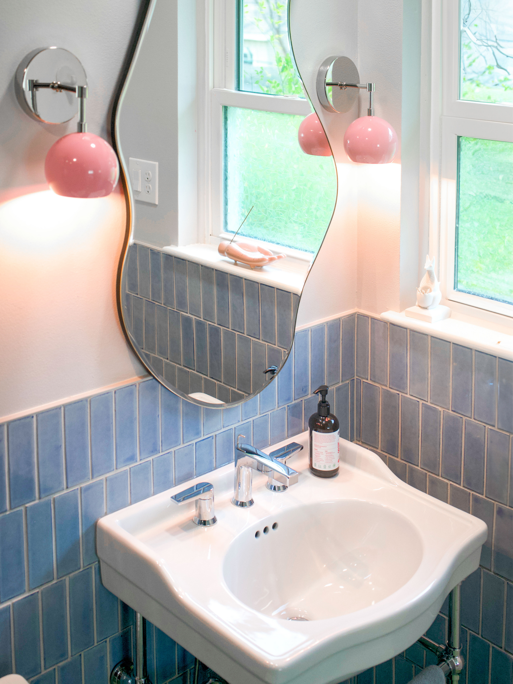 Blue 2x6 solid tile by Clay Imports, arranged vertically with white grout on a bathroom wall.