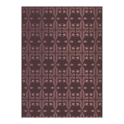 Deep plum wallpaper with blush pink botanical pattern by Clay Imports, featuring intricate, repeating fern and floral motifs.