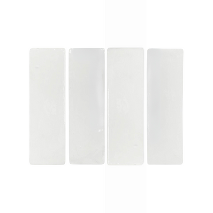White matte terracotta 2x6 tiles by Clay Imports, rectangular with smooth texture, arranged in a row on white background