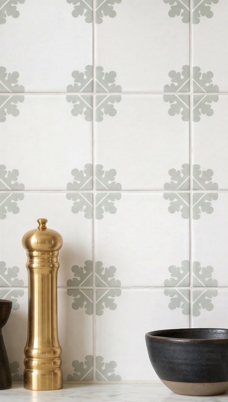 White Talavera Duncan Agave tile by Clay Imports Handmade Tile, featuring a grey agave leaf pattern on a kitchen backsplash.