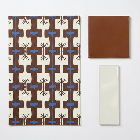 A Vintage Rhythm sample by Clay Imports, featuring a brown and blue patterned swatch, a terracotta square tile, and a cream rectangular tile.