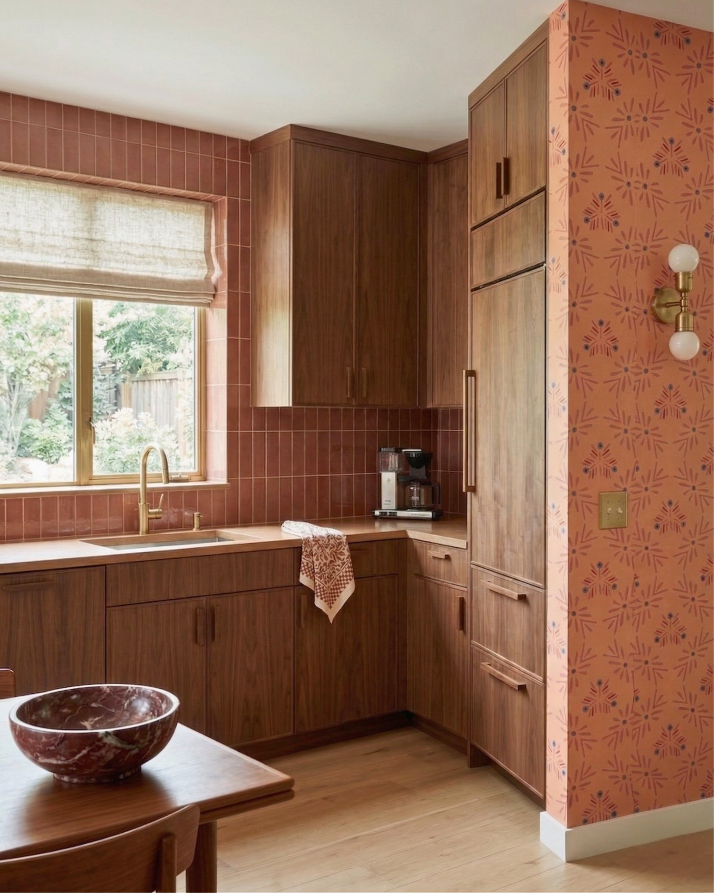 Glossy reddish-brown rectangular solid tile by Clay Imports, arranged vertically as a kitchen backsplash.