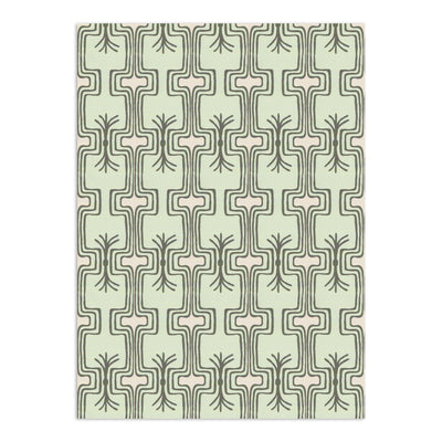 Pale green wallpaper by Clay Imports featuring a repeating pattern of dark grey stylized organic shapes with light pink horizontal bars.