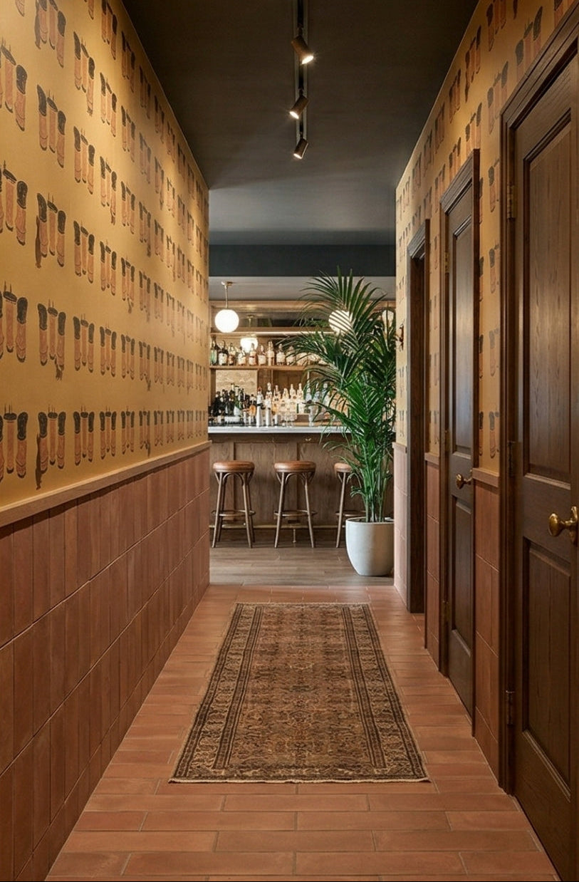 Umber 3x12 Cotto tiles by Clay Imports on a hallway floor and as vertical wainscoting.