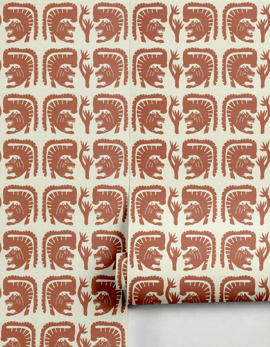 Terracotta and off-white Tristes Tigres wallpaper by Clay Imports, featuring stylized roaring tigers and abstract flora on an off-white background, with a rolled edge.