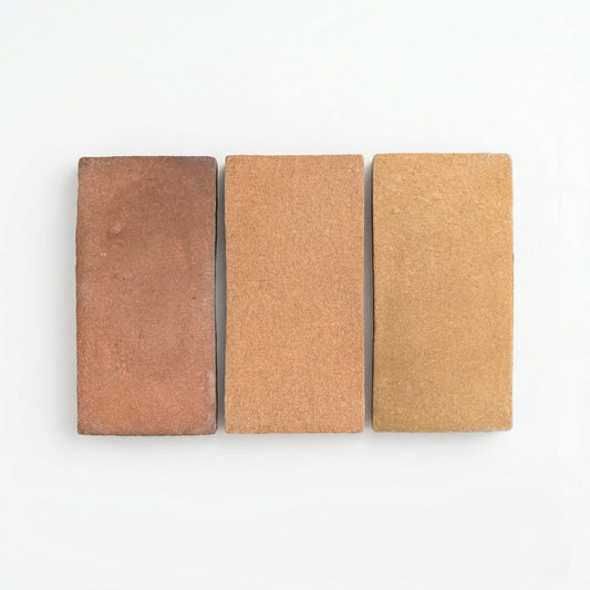 Three rectangular Ember Cotto samples from Clay Imports in varying brown shades with a coarse matte texture, displayed side-by-side.