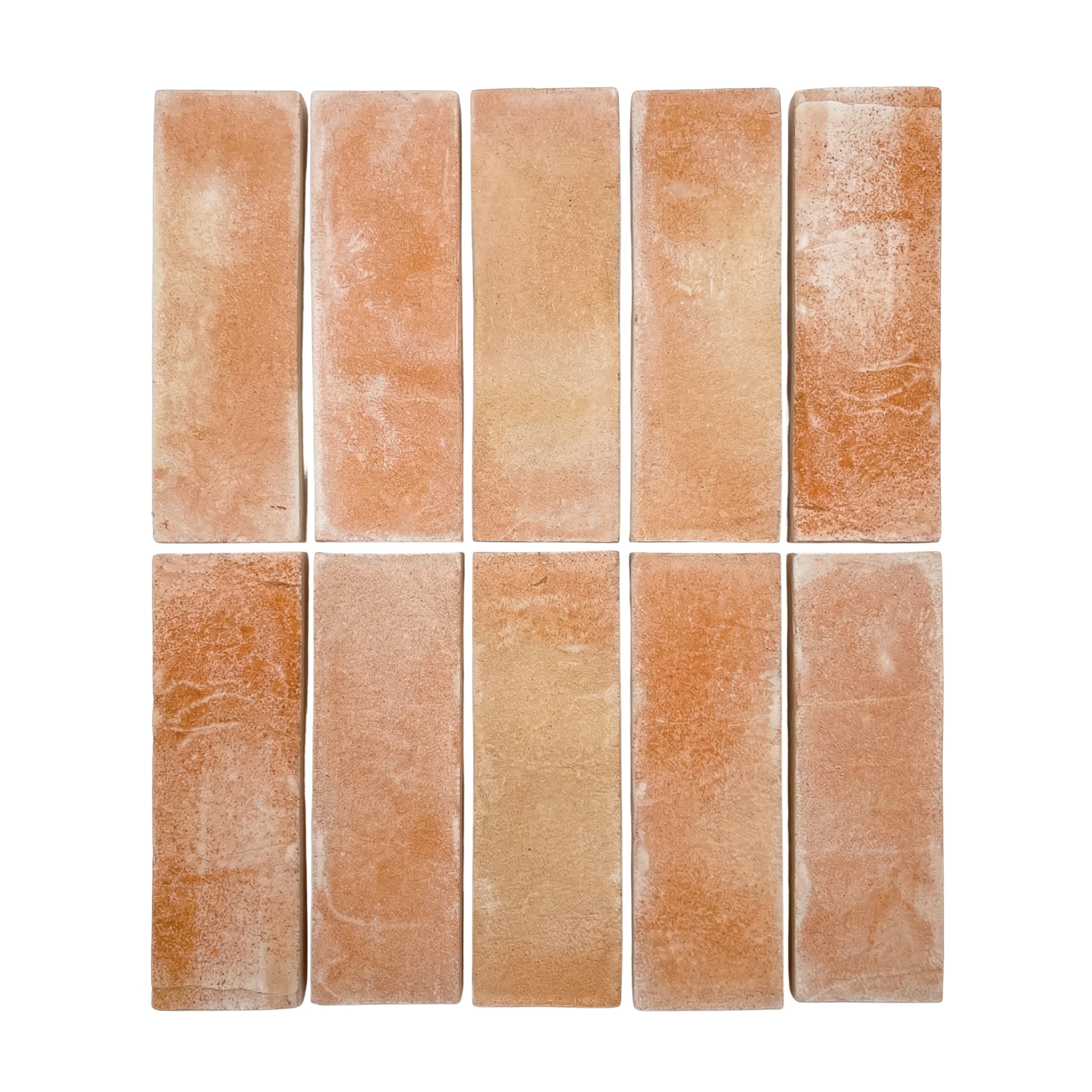 Bundle of matte terracotta tiles by Clay Imports, arranged in two rows with varied texture.