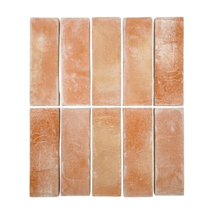Bundle of matte terracotta tiles by Clay Imports, arranged in two rows with varied texture.