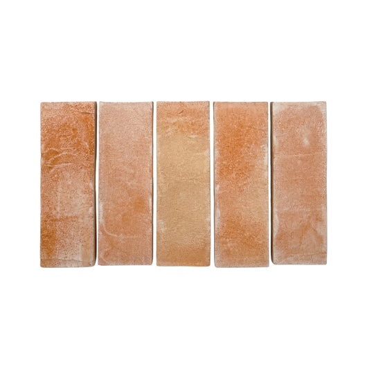 Five matte terracotta tiles by Clay Imports, arranged side-by-side, with a rough, textured surface and varying orange-brown hues.