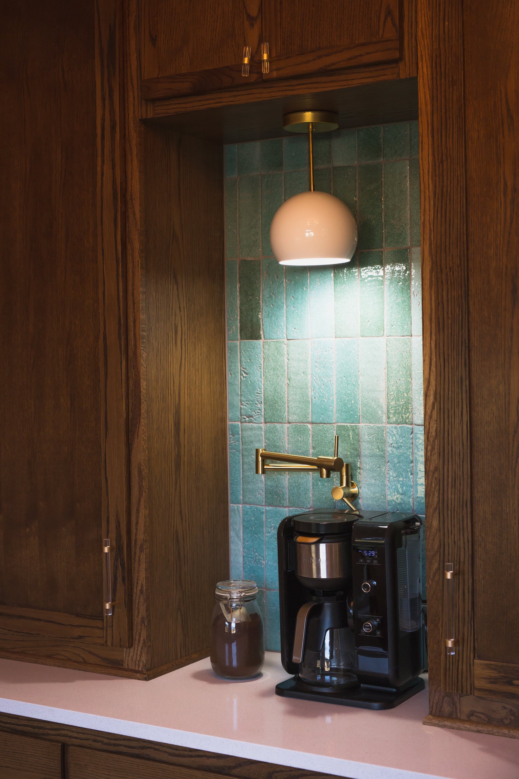 Light Green Glazed Thin Brick by Clay Imports, installed vertically as a kitchen backsplash with an irregular, glossy surface, in a coffee nook.