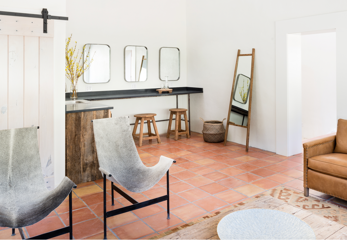 Smooth Satin 12x12 terracotta tile by Clay Imports, laid on a warm reddish-orange floor.