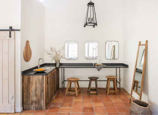 Smooth Satin 12x12 terracotta floor tiles by Clay Imports, in warm reddish-orange tones, covering a bright room.